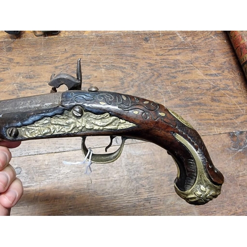 1773 - A 19th century Continental percussion pistol, with brass inlay.