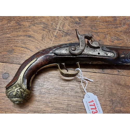 1773 - A 19th century Continental percussion pistol, with brass inlay.