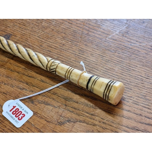 1803 - A late 18th/early 19th century marine ivory and whalebone cane, 83cm long. ... 