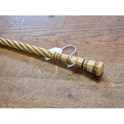 1803 - A late 18th/early 19th century marine ivory and whalebone cane, 83cm long. ... 