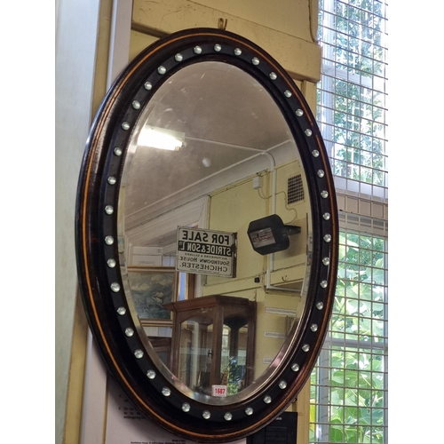 1687 - An Irish style oval wall mirror, 89 x 65cm.