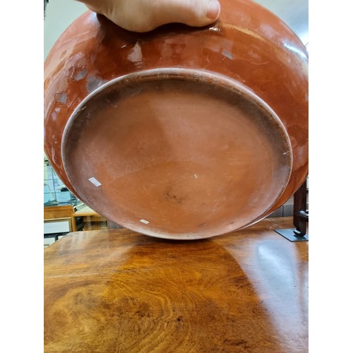 1406 - A large Watcombe pottery charger, 58.5cm diameter, (chip to rim). 