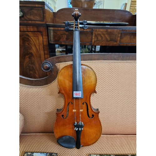 1682 - An antique Continental violin, possibly French, with 14in one piece back, in padded case. ... 