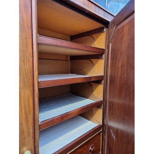 1209 - A Victorian mahogany triple wardrobe, 176cm wide. Provenance: by repute from Parham House.... 