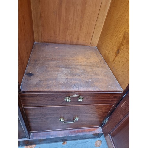 1209 - A Victorian mahogany triple wardrobe, 176cm wide. Provenance: by repute from Parham House.... 