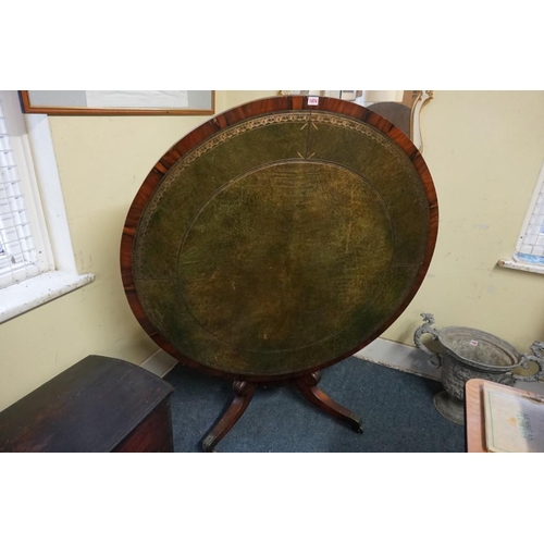 1177 - A 19th century rosewood and leather inset circular tilt-top table, 122cm diameter.... 