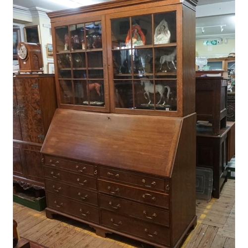 1179 - An unusually large early 20th century oak bureau bookcase, 155.5cm wide.