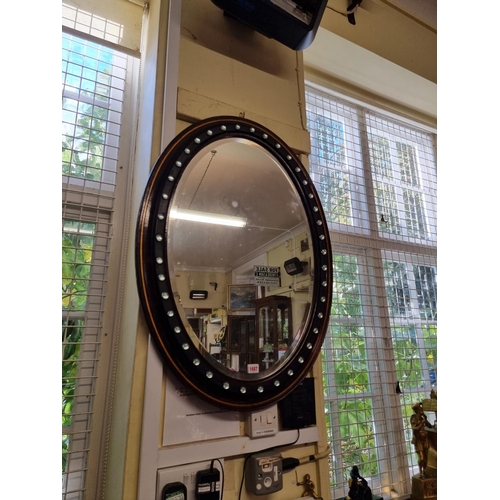 1673 - An Irish style oval wall mirror, 89 x 65cm.