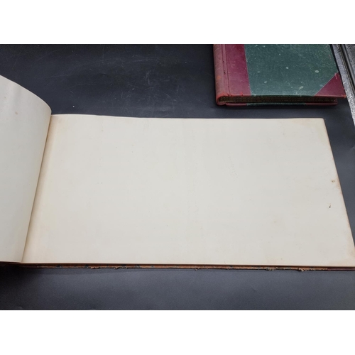 170 - LEDGERS: two old ledgers, red leather backed, one large oblong folio example with blank leaves, late... 