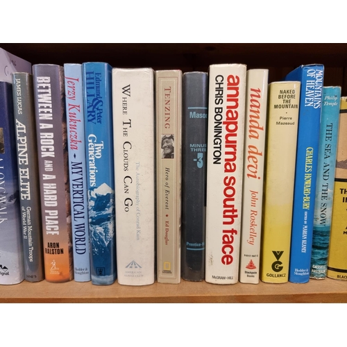 196 - MOUNTAINEERING: a collection of 61 mountaineering books across one shelf, largely hardback with... 