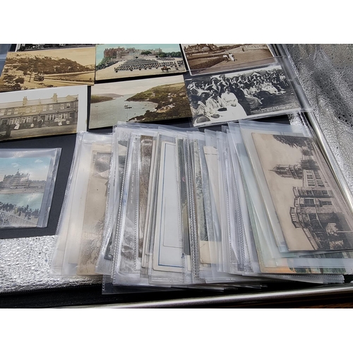 215 - POSTCARDS: a group of approx 150+ postcards, misc. subjects, to include RP view of HMS Suffolk ... 