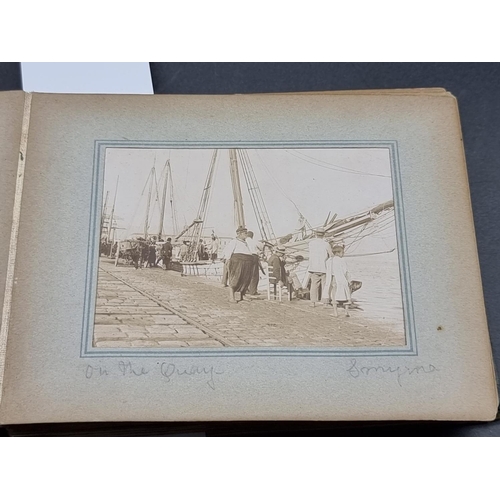 216 - PHOTOGRAPH ALBUM: Smyrna, Athens and New York scenes including quayside views, the racecourse, ... 