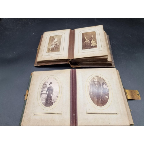 218 - CARTE DE VISITE: a collection in two small format albums of period. (2)