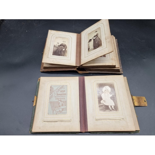 218 - CARTE DE VISITE: a collection in two small format albums of period. (2)