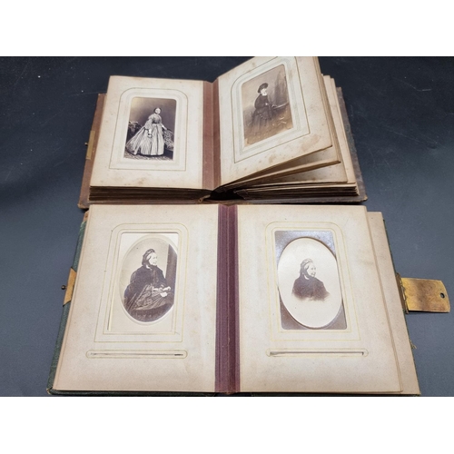 218 - CARTE DE VISITE: a collection in two small format albums of period. (2)