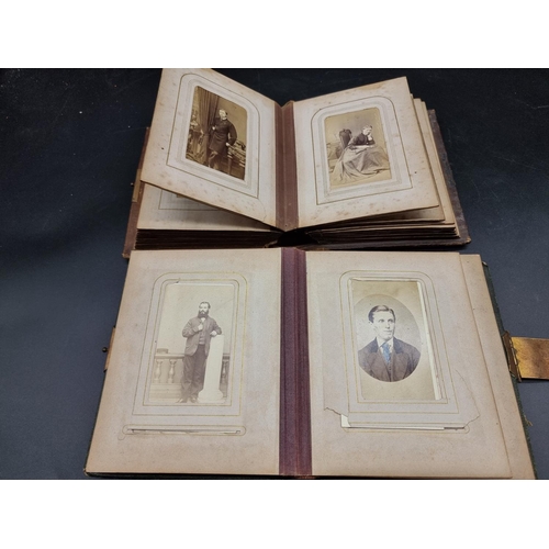 218 - CARTE DE VISITE: a collection in two small format albums of period. (2)