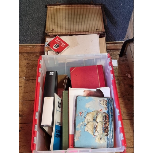 293 - STAMPS: a large and varied collection housed in numerous albums and tins. (Box and suitcase)... 