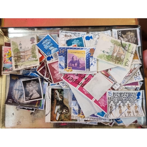 293 - STAMPS: a large and varied collection housed in numerous albums and tins. (Box and suitcase)... 