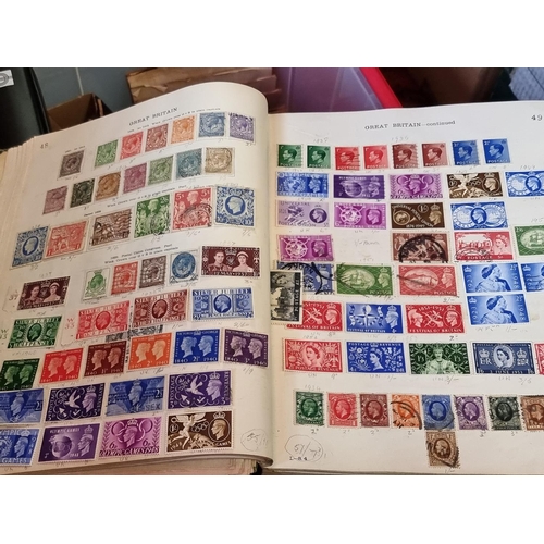 293 - STAMPS: a large and varied collection housed in numerous albums and tins. (Box and suitcase)... 