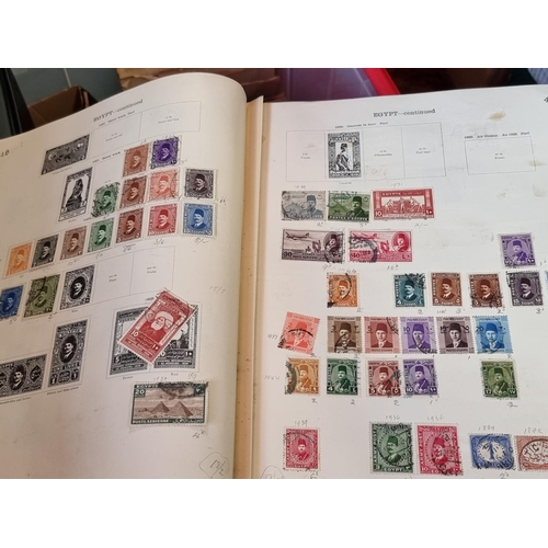 293 - STAMPS: a large and varied collection housed in numerous albums and tins. (Box and suitcase)... 