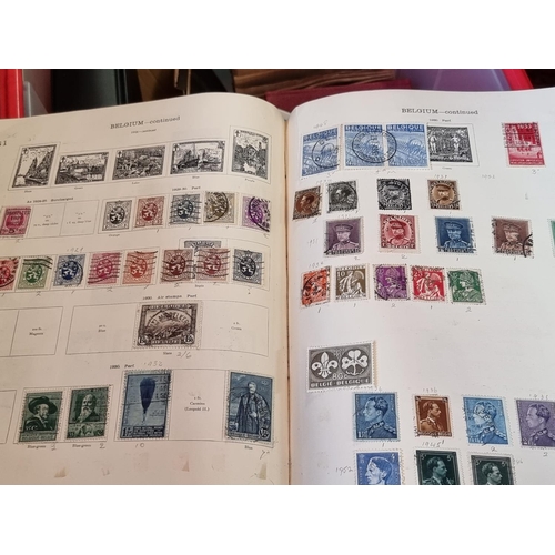 293 - STAMPS: a large and varied collection housed in numerous albums and tins. (Box and suitcase)... 