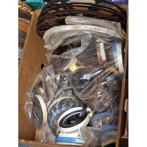 324 - FILM REELS: a large quantity of vintage film reels, many in metal tins, contained in 5 large boxes. ... 