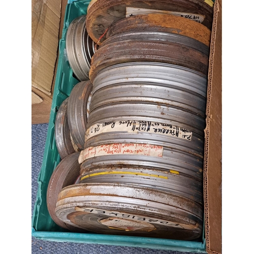 324 - FILM REELS: a large quantity of vintage film reels, many in metal tins, contained in 5 large boxes. ... 