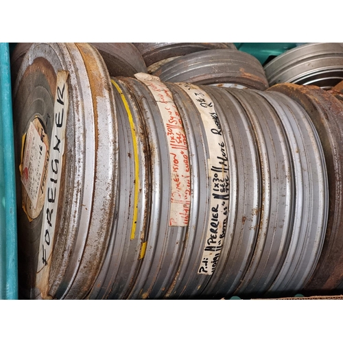 324 - FILM REELS: a large quantity of vintage film reels, many in metal tins, contained in 5 large boxes. ... 