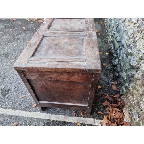 1004 - An early 18th century oak panelled coffer, 121cm wide.