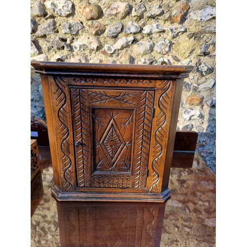 1007 - A carved oak miniature hanging corner cupboard, 37.5 x 38cm; together with two other caskets. (3)... 