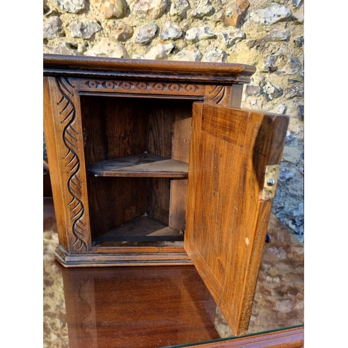 1007 - A carved oak miniature hanging corner cupboard, 37.5 x 38cm; together with two other caskets. (3)... 