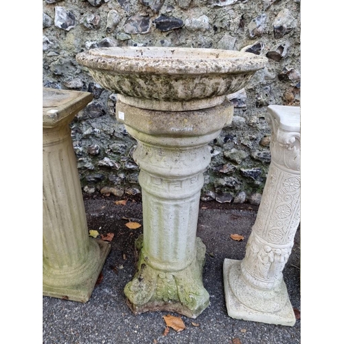 1012 - A small collection of composition stone pedestals and bird baths, (chips). ... 