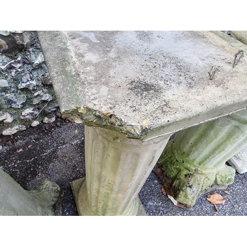 1012 - A small collection of composition stone pedestals and bird baths, (chips). ... 