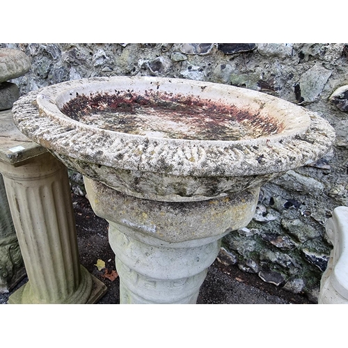 1012 - A small collection of composition stone pedestals and bird baths, (chips). ... 