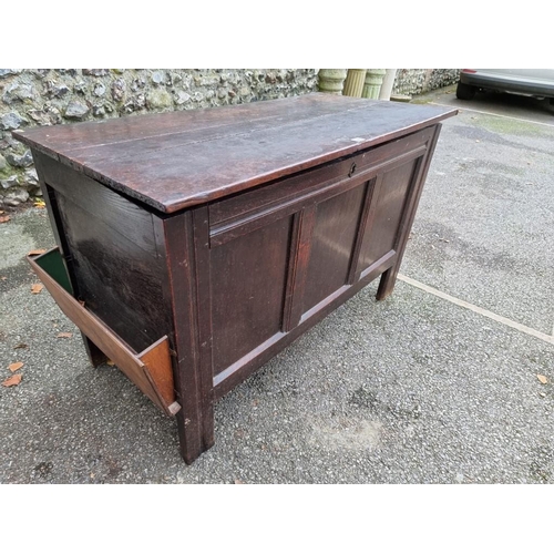 1013 - A late 17th/early 18th century oak panelled coffer, 115cm wide.