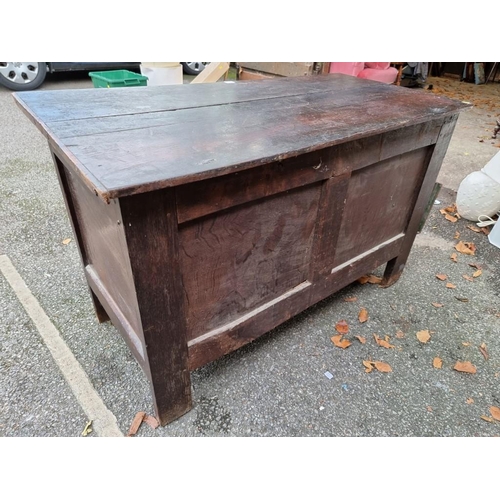 1013 - A late 17th/early 18th century oak panelled coffer, 115cm wide.