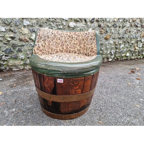 1020 - An oak and copper barrel chair. 