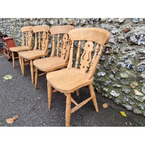 1021 - A set of four beech kitchen chairs. 