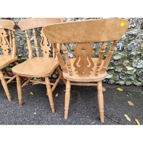 1021 - A set of four beech kitchen chairs. 