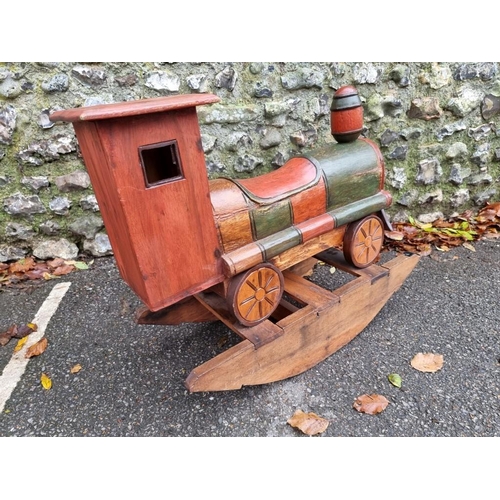 1022 - A child's painted wood rocking train, 80cm wide.