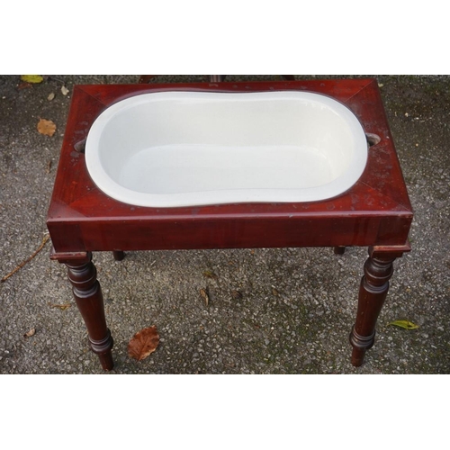 1051 - A 19th century tripod table, together with a mahogany bidet and liner.