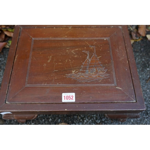 1052 - An eastern brass tray; together with a carved oriental footstool, with reversible top.... 