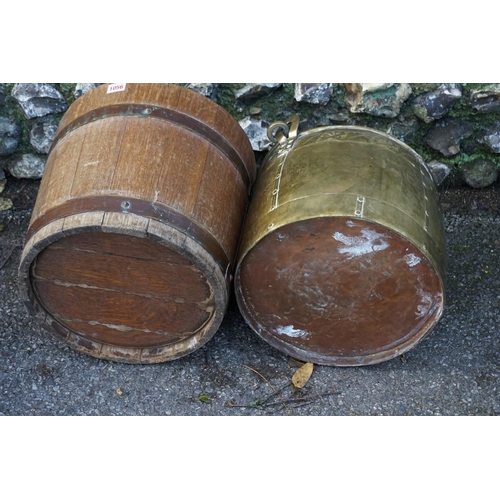 1056 - A brass swing handled log basket; together with another oak log bin.