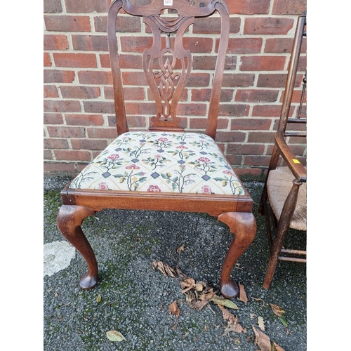 1073 - An antique mahogany dining chair, having tapestry set; together with an oak and cane seated chair. (... 