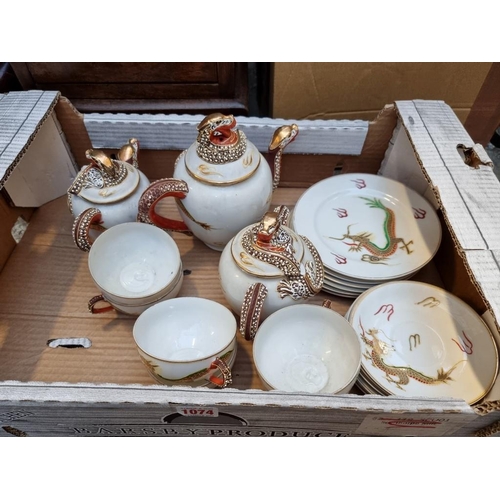 1074 - A Japanese porcelain part tea service.