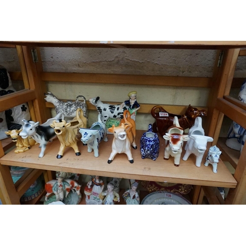 1124 - A collection of cow creamers, to include a Leedsware 'Classic Creamware' example; and a Victorian St... 