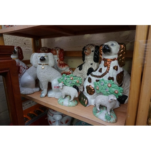 1130 - A collection of Victorian Staffordshire pottery, comprising: three pairs of dogs, largest 25cm high;... 