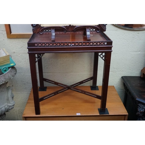 1146 - A reproduction mahogany silver type table, with fretwork decoration, 62cm wide.