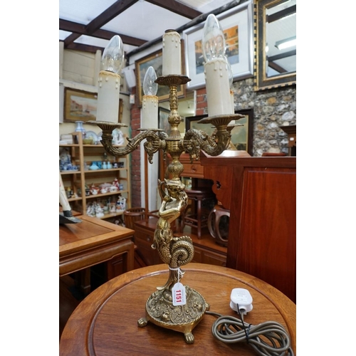 1151 - A brass figural five branch table light, 58.5cm high.