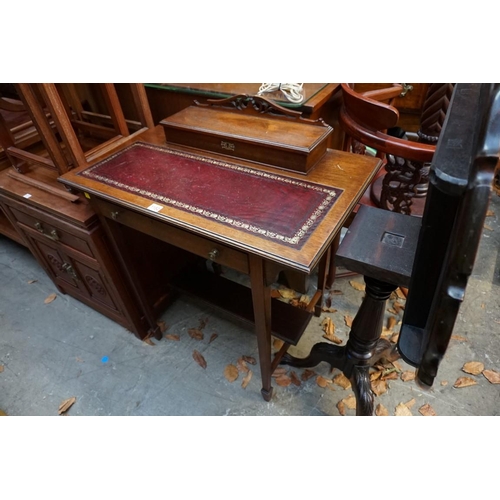 1152 - An Edwardian walnut desk, 76cm wide. 